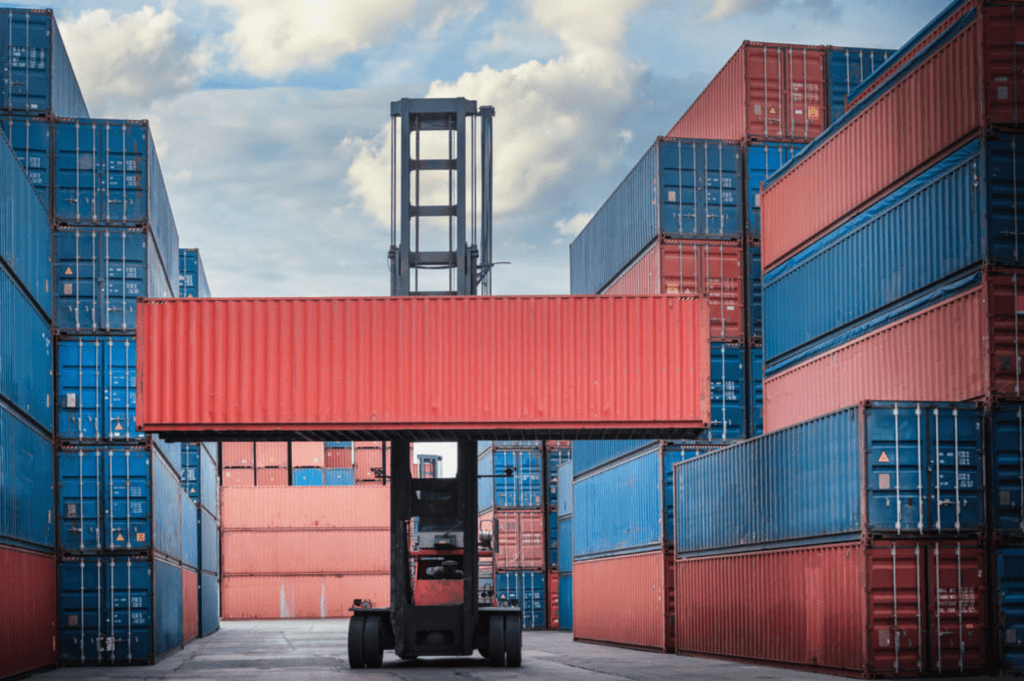Forklift loading goods onto pallets for efficient transload services in Savannah, GA