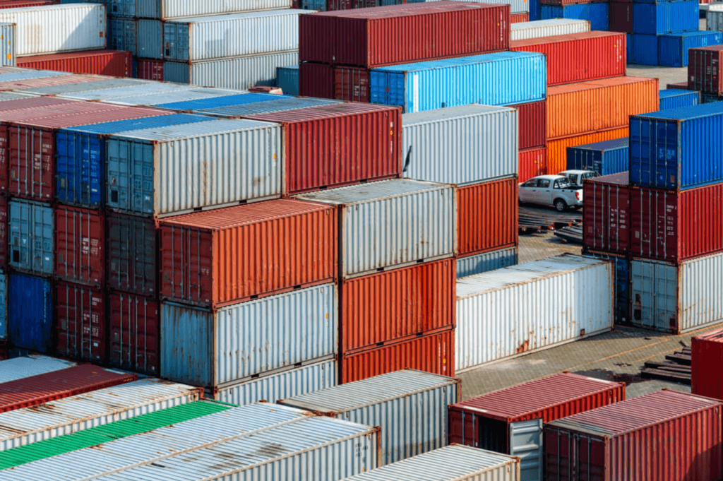 Stacked shipping containers at Memphis for drayage and intermodal trucking.
