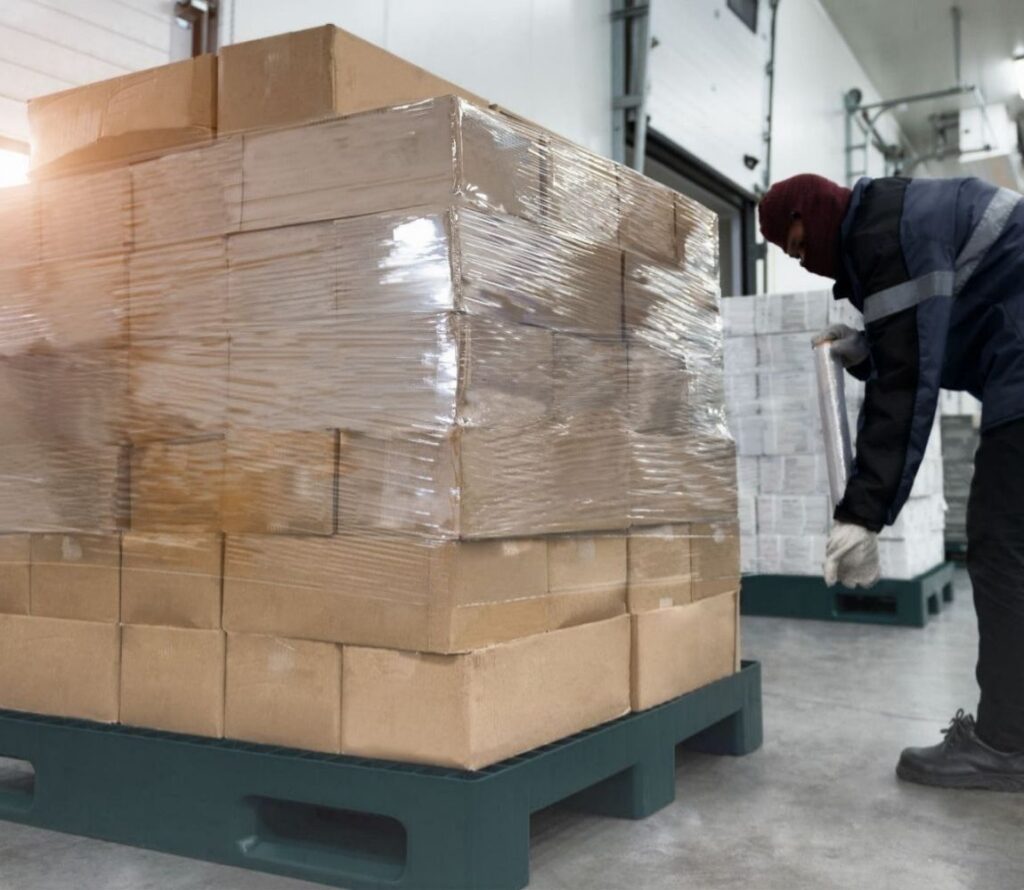 Pallet rework and restacking services at OLIMP Warehousing in Kansas City.