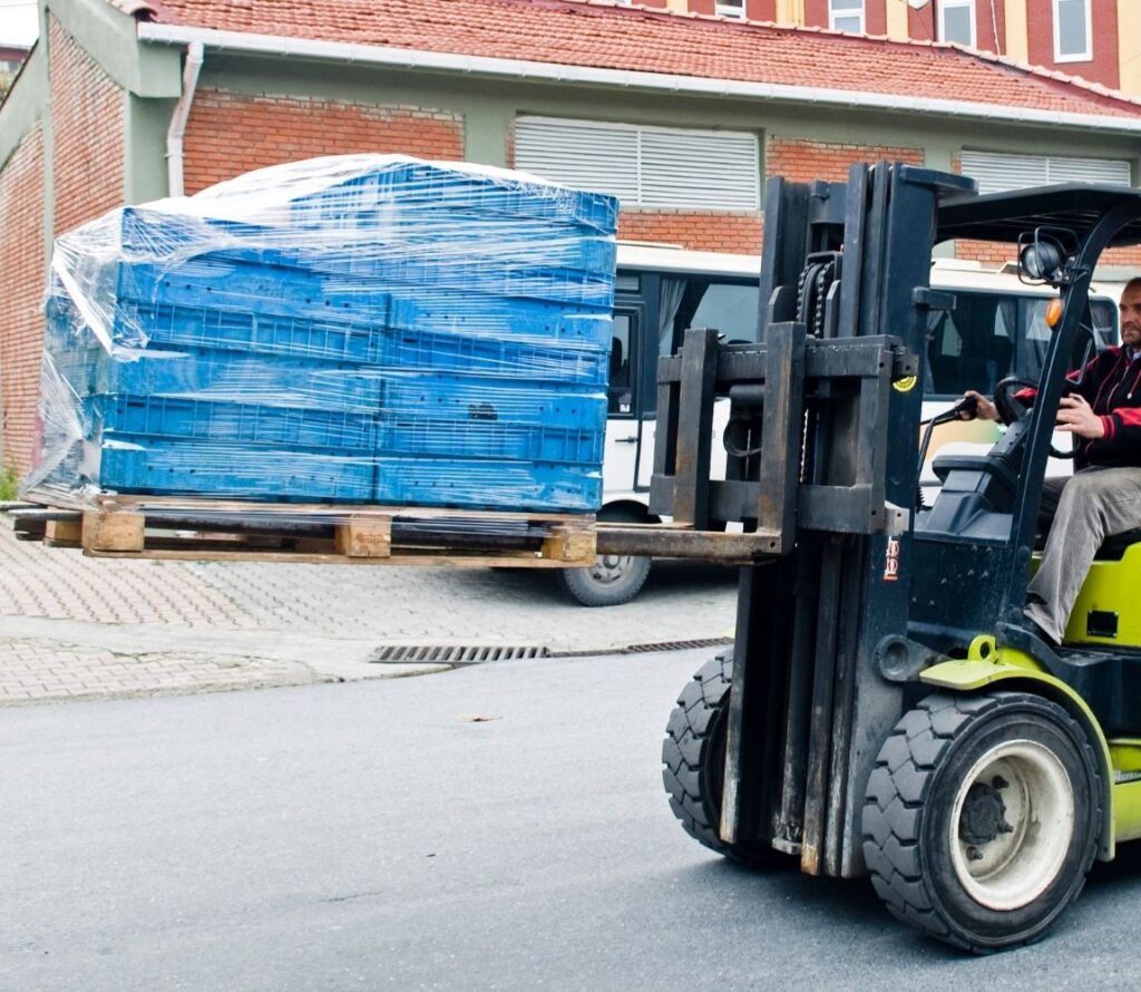 Pallet rework and repackaging services in Montgomery, AL including inspection, labeling, and shrink wrapping.