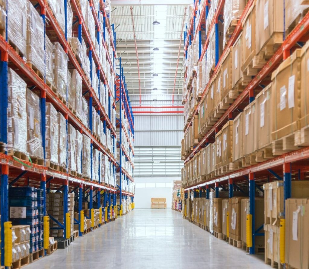 Pallet storage and racked inventory inside a breinigsville pennsylvania warehouse with forklifts in operation.