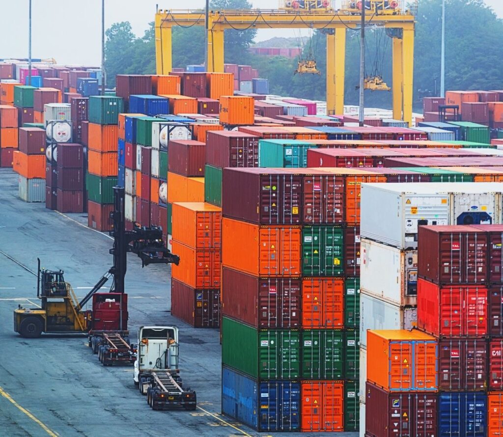 Drayage truck transporting container from port to warehouse in Maryland.