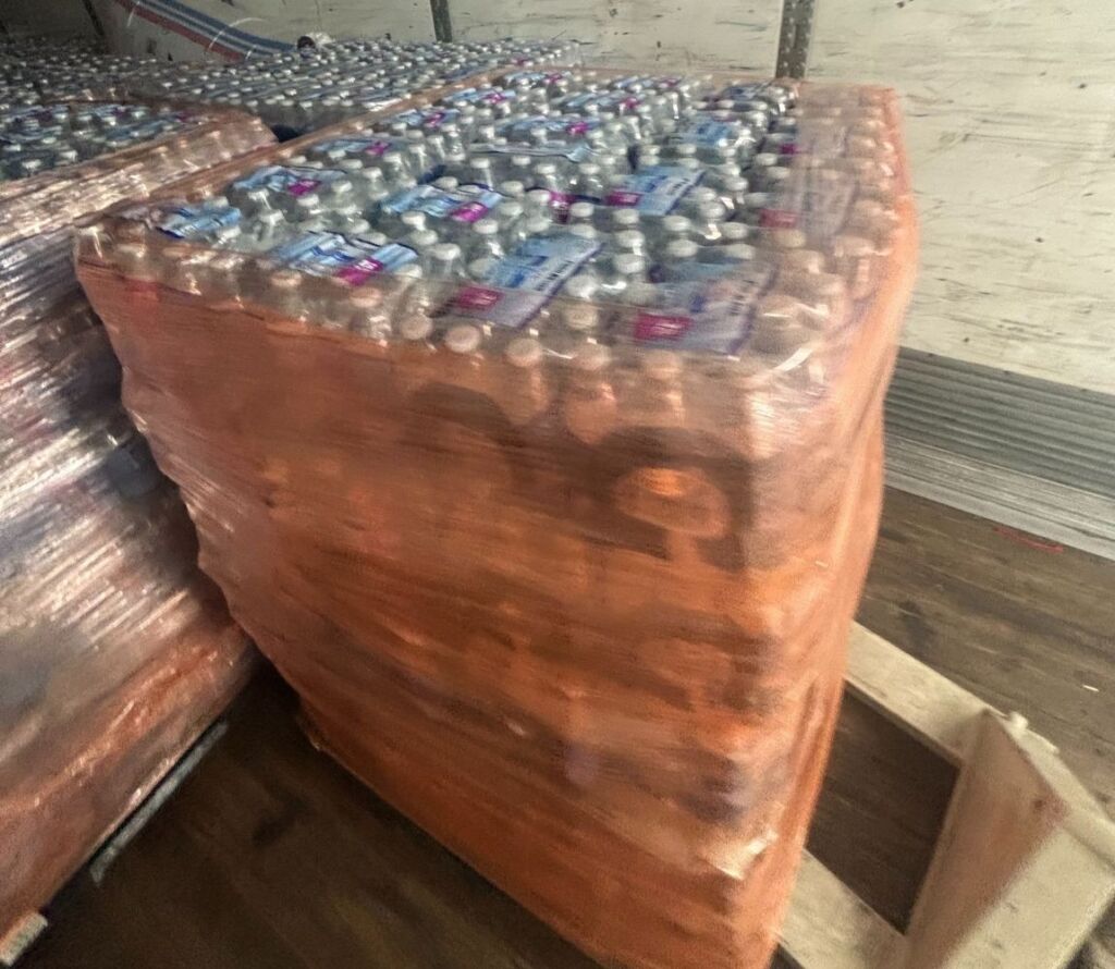 pallet rework services fixing shifted pallets and restacking freight in Tuscaloosa warehouse facility.